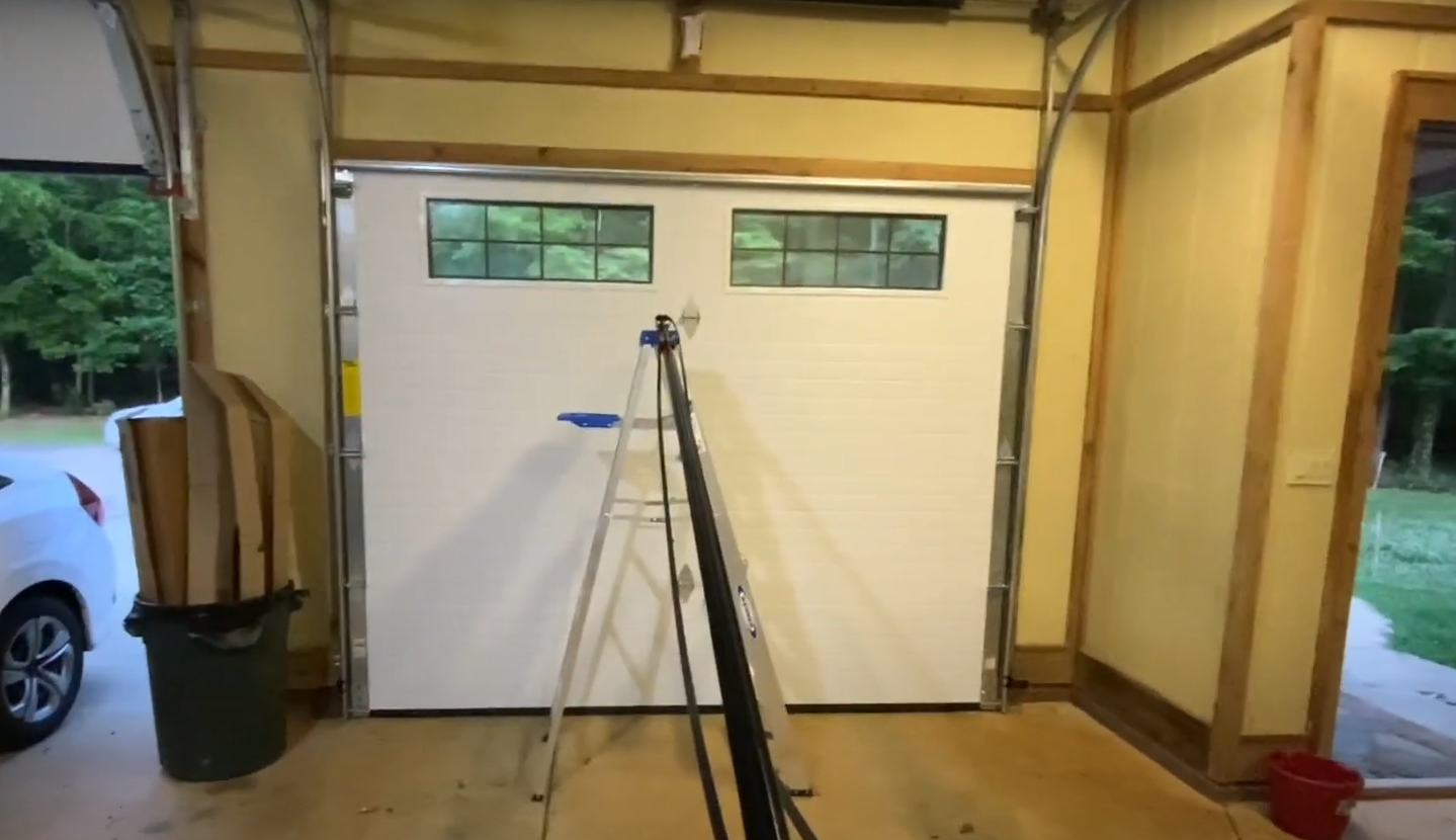 "Garage door replacement process with a modern and durable door installation"